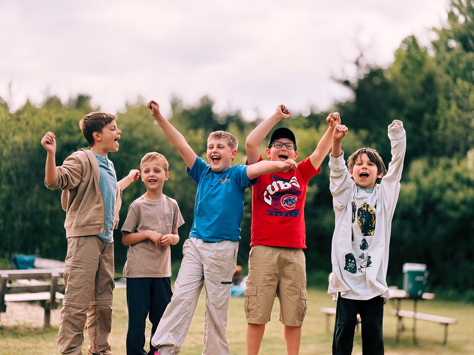 Group of Scouts cheering together outdoors
